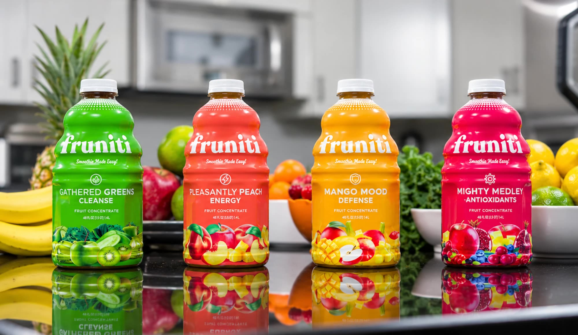 All four Fruniti flavors lined up on a real kitchen counter surrounded by fresh fruit