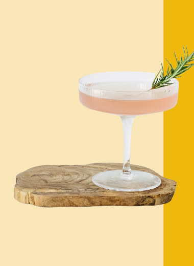 A Fruniti-elevated cocktail garnished with rosemary