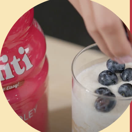Adding blueberries to a Mighty Medley smoothie
